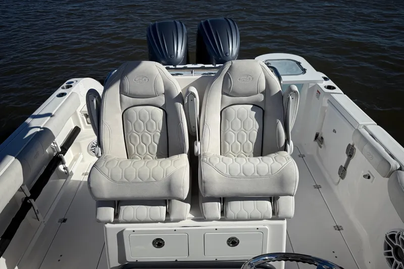 Slide: The Image of 2022 Sea Fox 288 Commander boat with dual seats and twin engines on water. - 22
