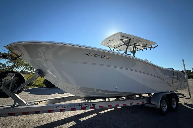 Slide: The Image of 2022 Sea Fox 288 Commander boat on trailer under clear blue sky. - 3