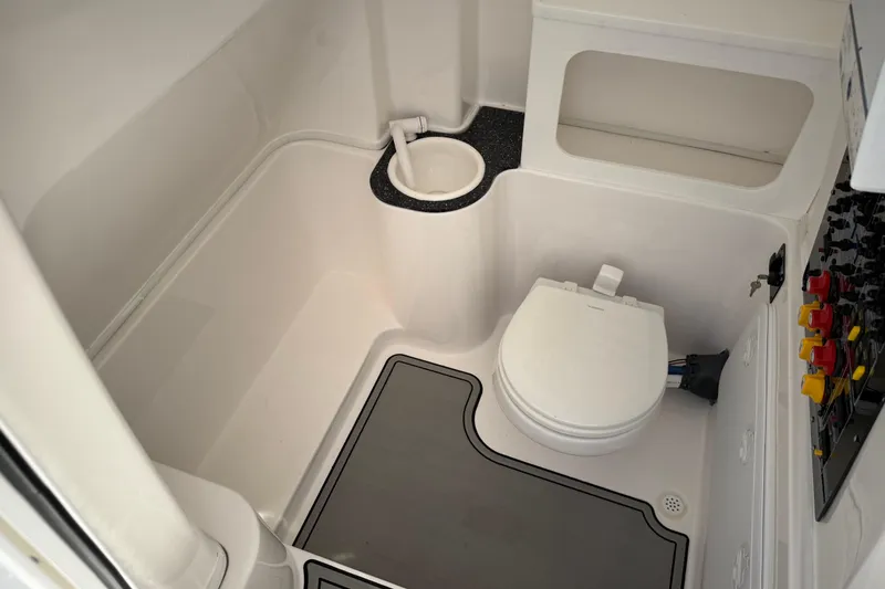 Slide: The Image of 2022 Sea Fox 288 Commander boat bathroom with toilet and sink. - 38