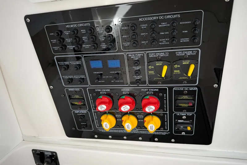 Slide: The Image of Control panel of a 2022 Sea Fox 288 Commander boat with various switches and gauges. - 39