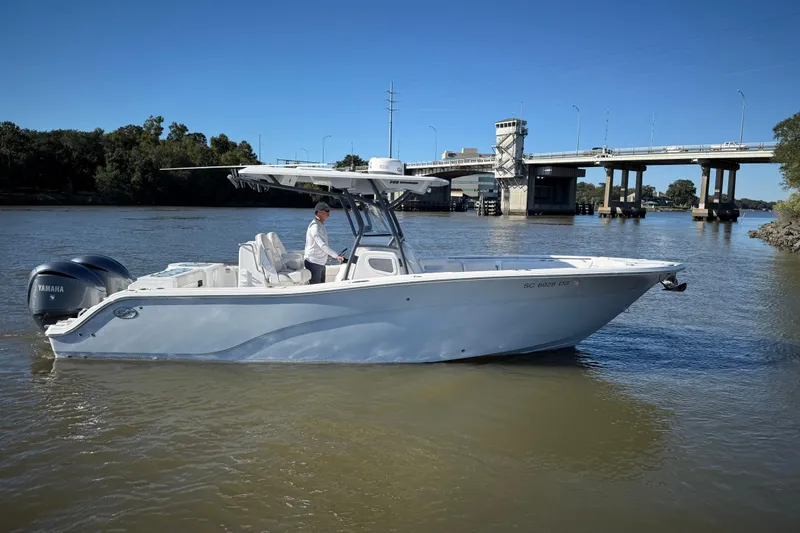 Slide: The Image of 2022 Sea Fox 288 Commander boat on a river near a bridge. - 8