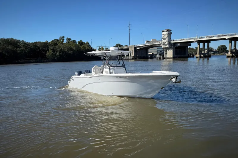 Slide: The Image of 2022 Sea Fox 288 Commander boat cruising near a bridge on a sunny day. - 9