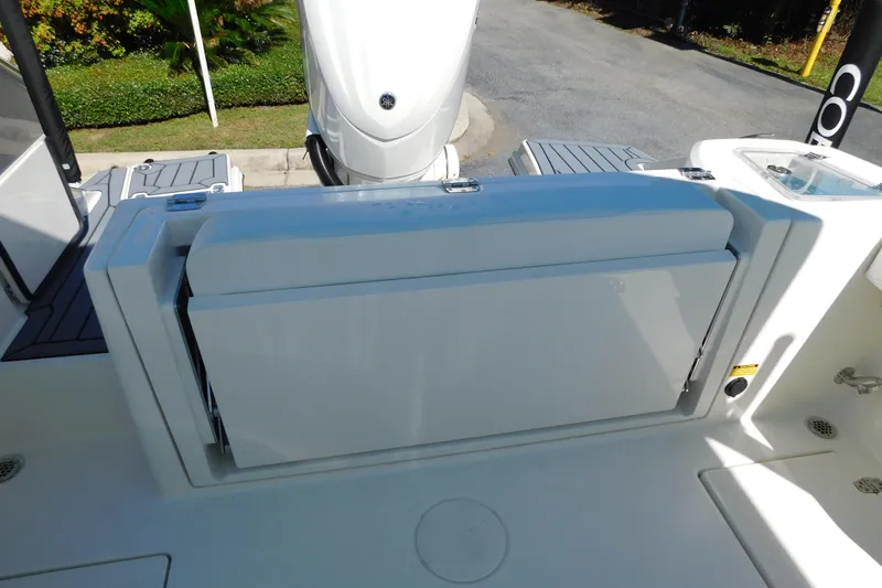 Slide: The Image of 2026 Cobia 240 Dual Console boat sink with chrome faucet and white countertop. - 14