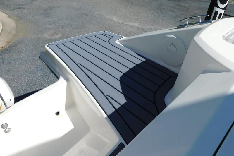 Slide: The Image of 2026 Cobia 240 Dual Console boat deck with sleek, modern design and durable flooring. - 33