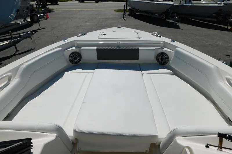 Slide: The Image of 2026 Cobia 240 Dual Console boat with spacious seating and modern design. - 39