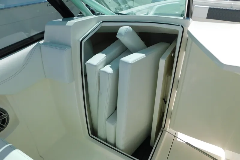 Slide: The Image of 2026 Cobia 240 Dual Console boat bathroom with sink and toilet. - 43