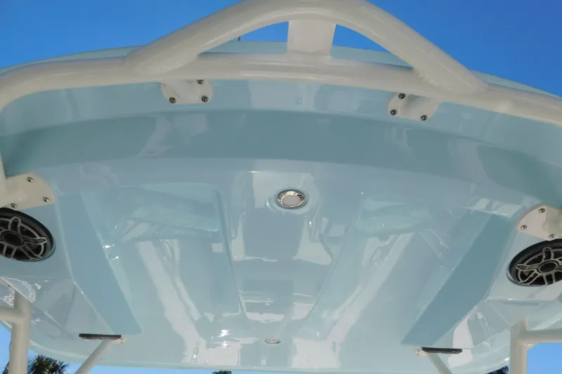 Slide: The Image of Livewell on 2026 Cobia 240 Dual Console boat, featuring a clear lid and stainless steel latch. - 45