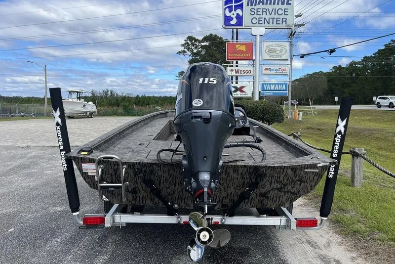 Slide: The Image of 2026 Xpress XP200 boat with Yamaha motor at marine service center. - 10