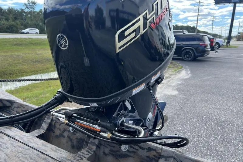 Slide: The Image of 2026 Xpress XP200 boat with Yamaha outboard motor in parking lot. - 15