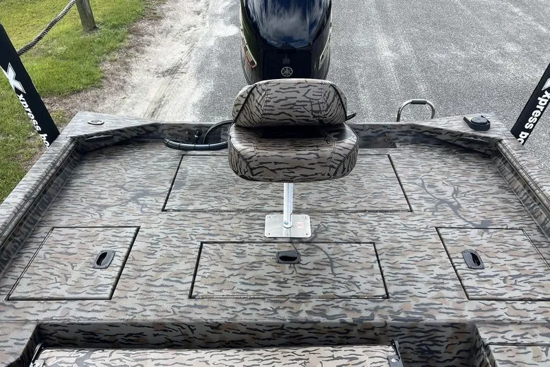 Slide: The Image of 2026 Xpress XP200 boat deck with camo pattern and central seat. - 16