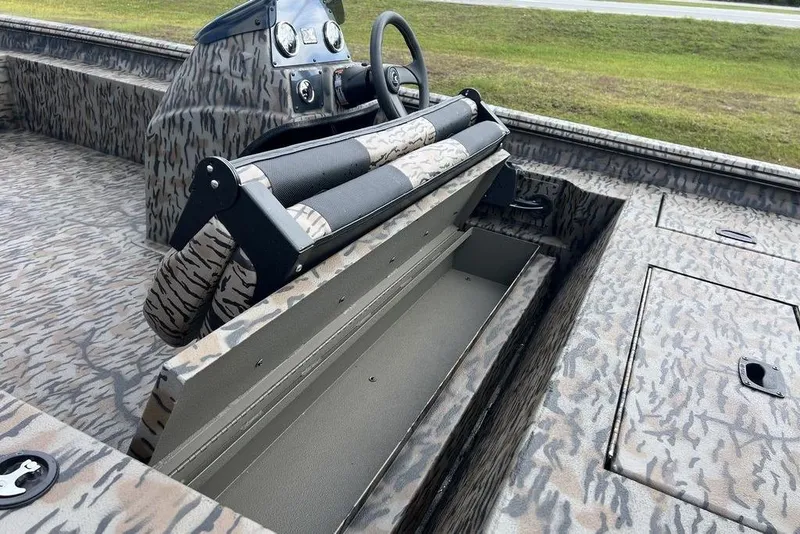 Slide: The Image of 2026 Xpress XP200 boat interior with camouflage design and storage compartments. - 17