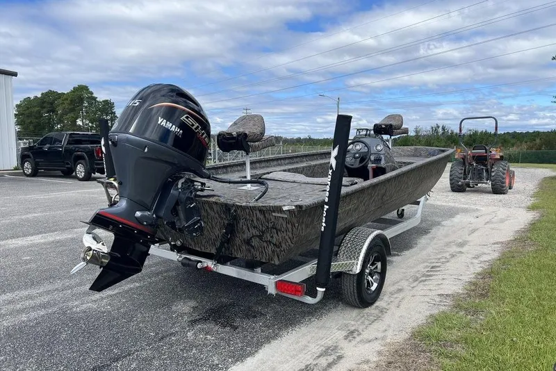 Slide: The Image of 2026 Xpress XP200 boat with Yamaha engine on trailer, parked outdoors. - 6