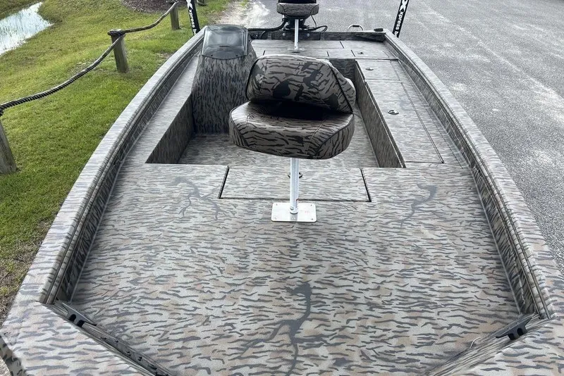 Slide: The Image of 2026 Xpress XP200 boat with camouflage pattern, featuring a swivel seat and spacious deck. - 9