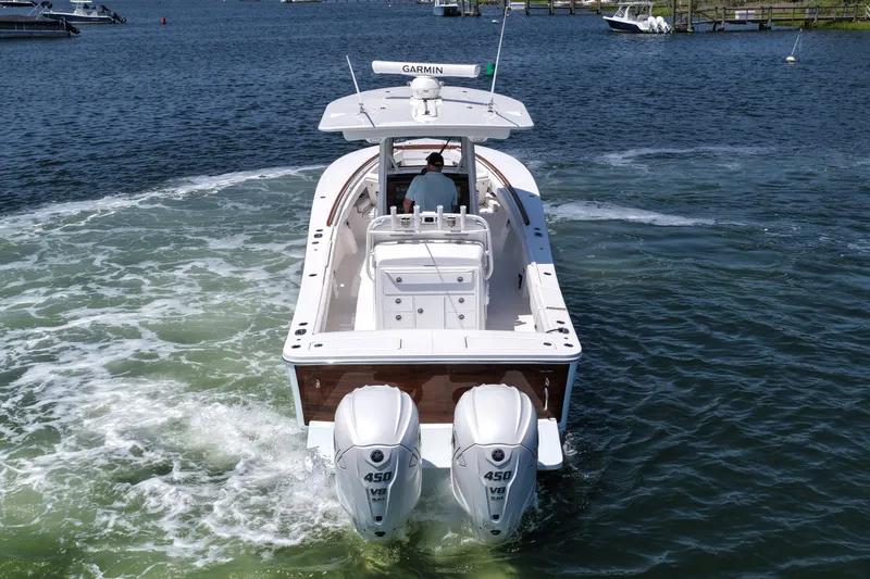 Slide: The Image of 2025 Regulator 31 boat with twin 450 V8 engines on water. - 12