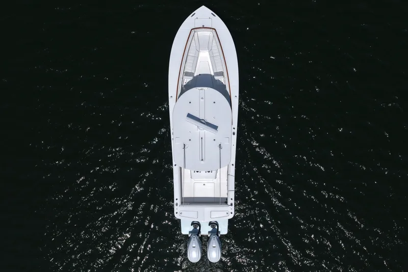 Slide: The Image of Overhead view of 2025 Regulator 31 boat on dark water. - 14