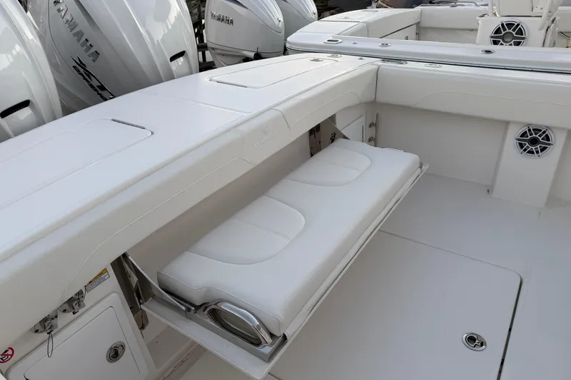 Slide: The Image of 2025 Regulator 31 boat interior with foldable seating and Yamaha engines. - 18