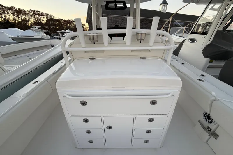 Slide: The Image of 2025 Regulator 31 boat interior with rod holders and storage compartments. - 21