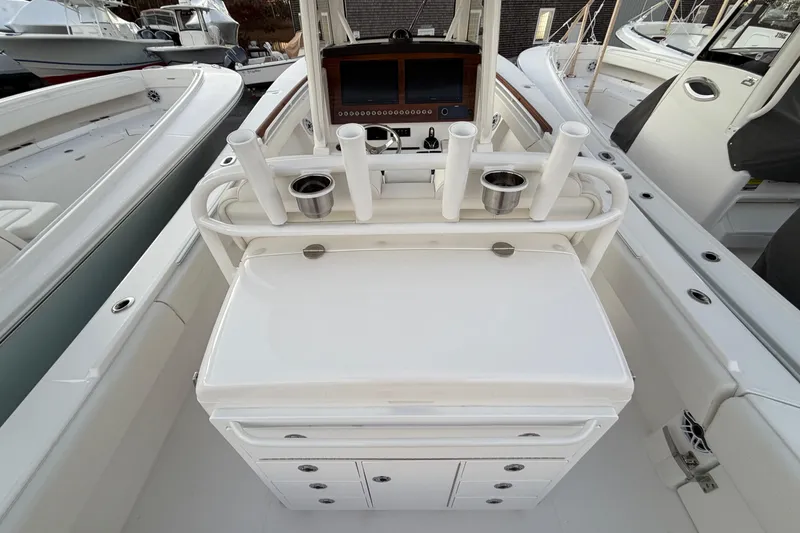 Slide: The Image of 2025 Regulator 31 boat cockpit with rod holders and control panel. - 22