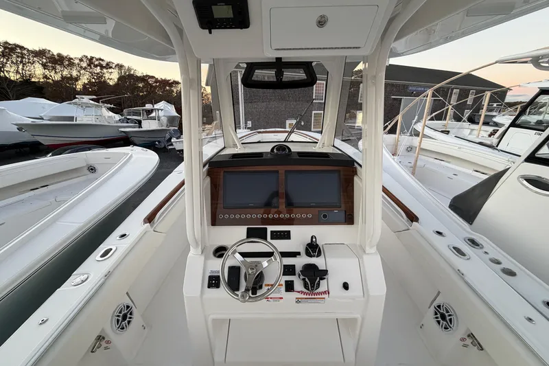 Slide: The Image of 2025 Regulator 31 boat cockpit with modern controls and navigation system. - 26