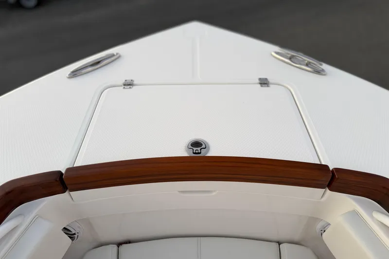 Slide: The Image of Bow of 2025 Regulator 31 boat with sleek design and wood accents. - 35