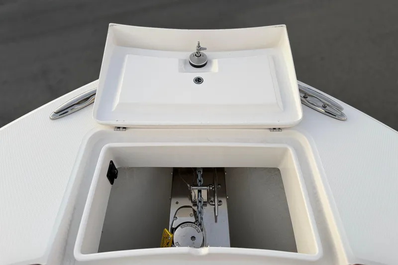 Slide: The Image of 2025 Regulator 31 boat anchor compartment with open hatch, showcasing storage and hardware. - 36