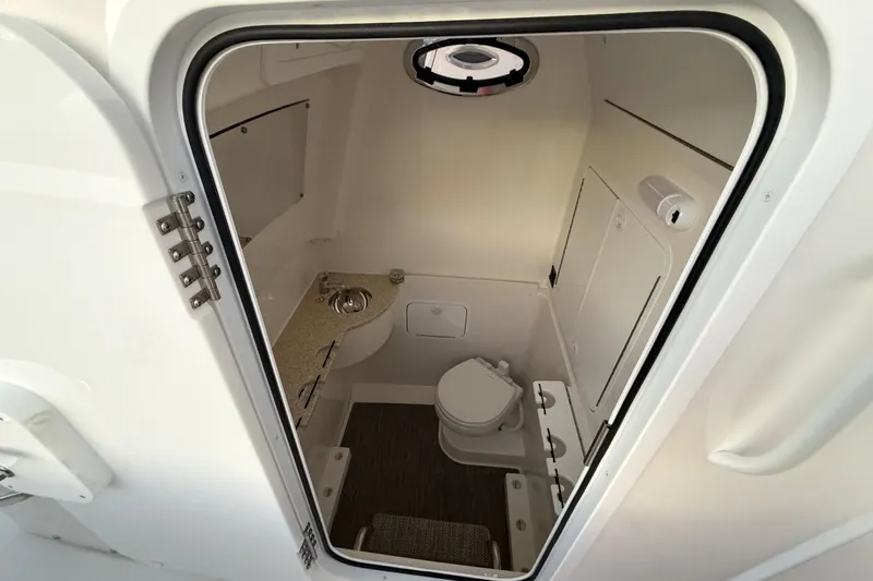 Slide: The Image of 2025 Regulator 31 boat interior bathroom with toilet and sink. - 41