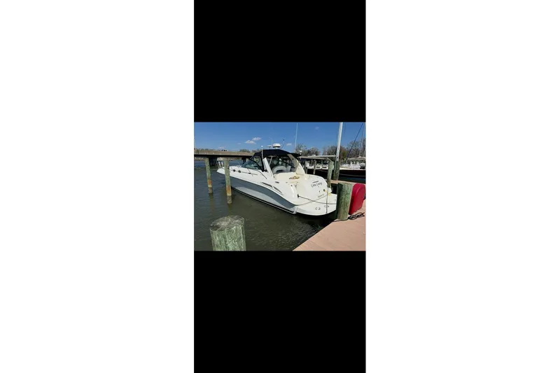 Slide: The Image of 2001 Sea Ray 410 Sundancer yacht docked at marina on a sunny day. - 10