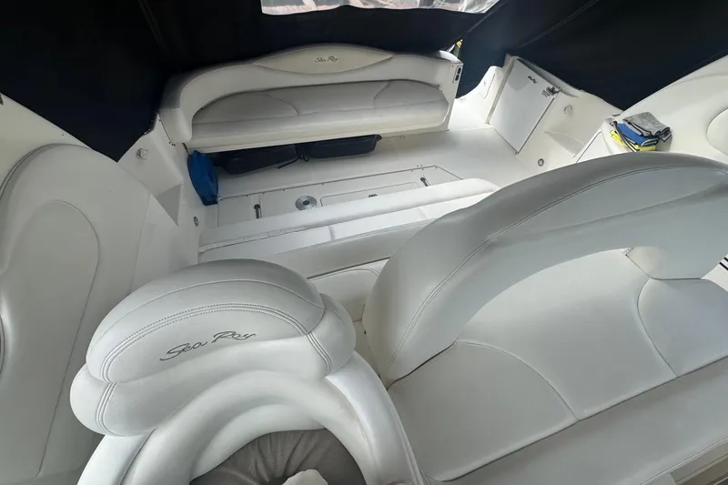 Slide: The Image of Interior of 2001 Sea Ray 410 Sundancer with white leather seating and sleek design. - 11