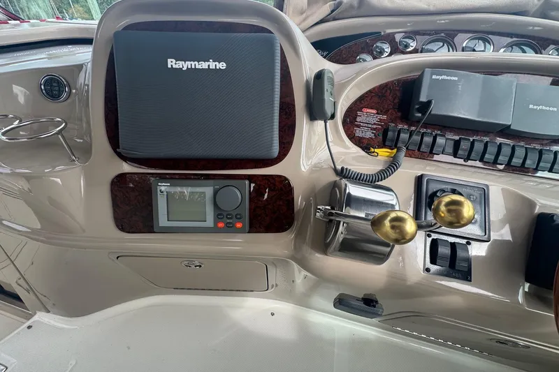 Slide: The Image of Control panel of a 2001 Sea Ray 410 Sundancer with Raymarine equipment. - 18