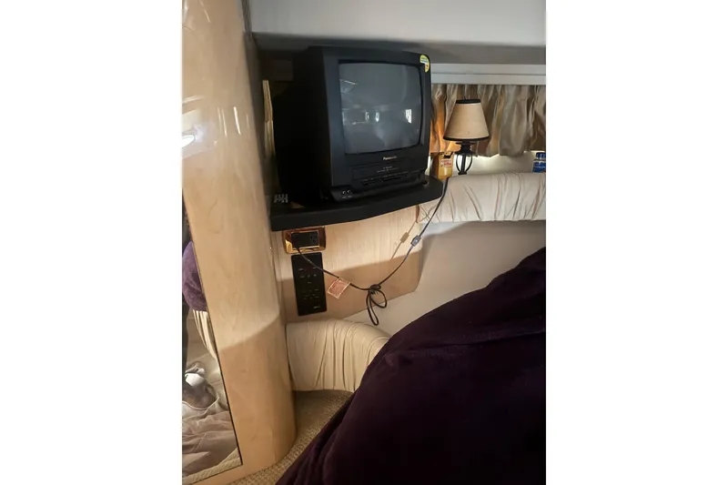 Slide: The Image of 2001 Sea Ray 410 Sundancer cabin with vintage TV and cozy interior. - 24