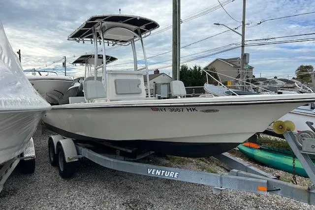 The Image of 2023 May-Craft 22 Handcock boat on trailer, parked outdoors under cloudy sky. - 0