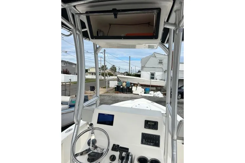 Slide: The Image of 2023 May-Craft 22 Handcock boat console with steering wheel and navigation equipment. - 10