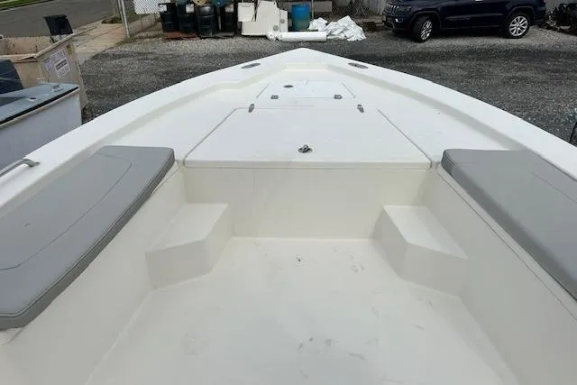 Slide: The Image of 2023 May-Craft 22 Handcock boat interior with seating and storage compartments. - 2