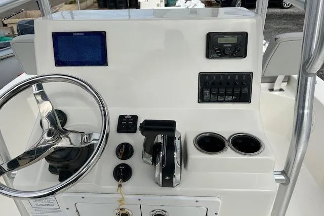 Slide: The Image of Control panel of 2023 May-Craft 22 Handcock boat with steering wheel and gauges. - 3