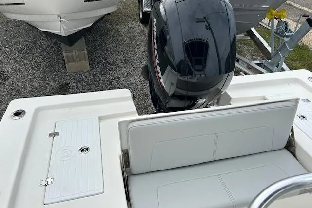 Slide: The Image of 2023 May-Craft 22 Handcock boat with Mercury outboard motor and white seating. - 4