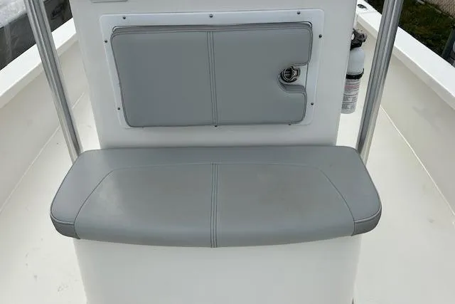 Slide: The Image of 2023 May-Craft 22 Handcock boat seat with gray cushioned backrest and bench. - 6