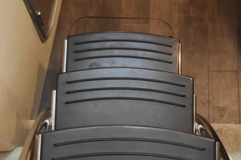 Slide: The Image of Steps inside a 2021 Regal 26 XO boat, featuring sleek black design. - 107