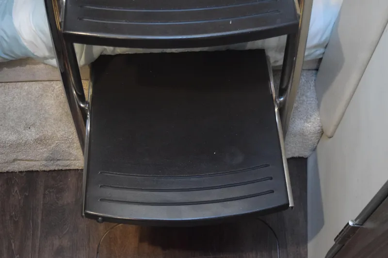 Slide: The Image of Black step ladder inside 2021 Regal 26 XO boat interior. - 111
