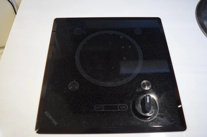Slide: The Image of Kenyon electric cooktop on Regal 26 XO boat, 2021 model. - 128