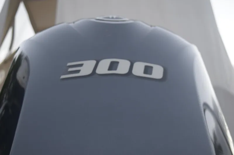 Slide: The Image of Close-up of a 300 horsepower engine on a 2021 Regal 26 XO boat. - 14