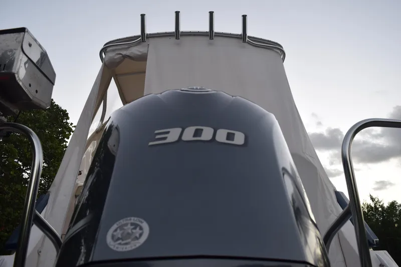 Slide: The Image of 2021 Regal 26 XO boat with 300 horsepower engine, viewed from the rear. - 15