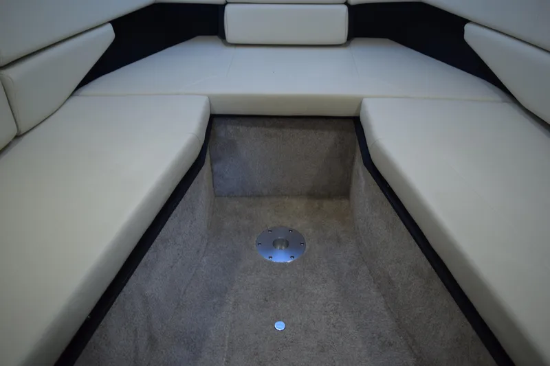 Slide: The Image of 2021 Regal 26 XO boat interior with beige seating and carpeted flooring. - 155