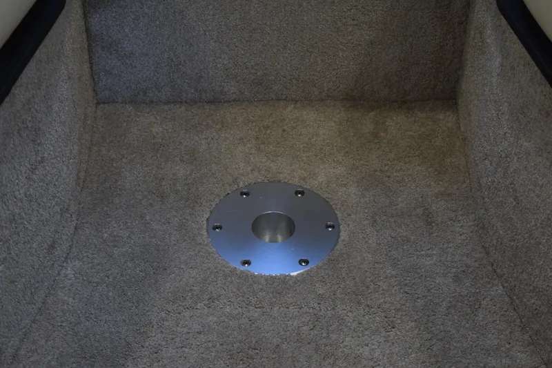 Slide: The Image of Carpeted floor with metal fixture in a 2021 Regal 26 XO boat. - 156
