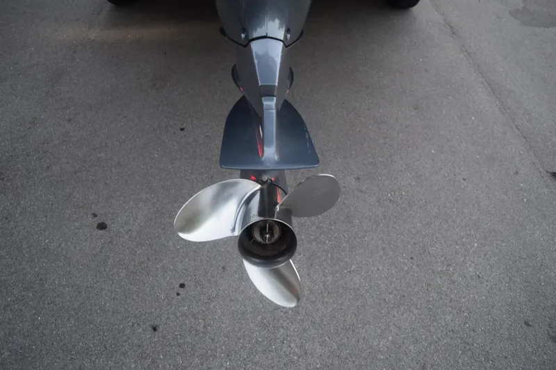 Slide: The Image of Close-up of a 2021 Regal 26 XO boat propeller on pavement. - 16