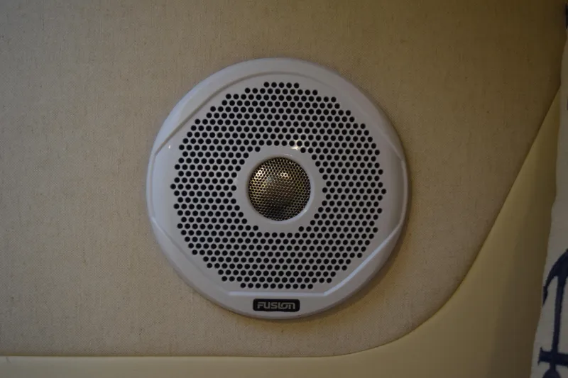 Slide: The Image of Fusion speaker on 2021 Regal 26 XO boat interior wall. - 163