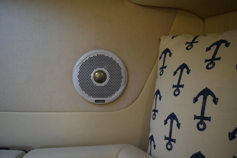Slide: The Image of Speaker and anchor-patterned cushion in 2021 Regal 26 XO boat interior. - 164