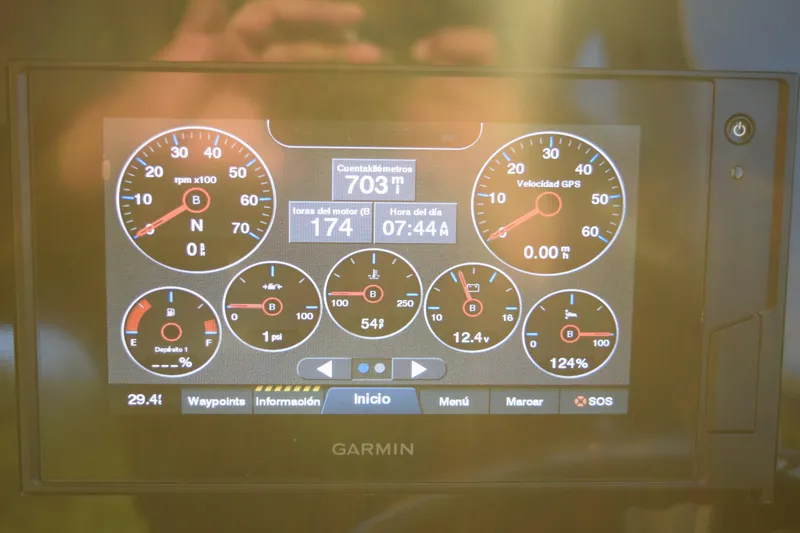 Slide: The Image of Garmin display on 2021 Regal 26 XO boat showing engine metrics and GPS speed. - 174