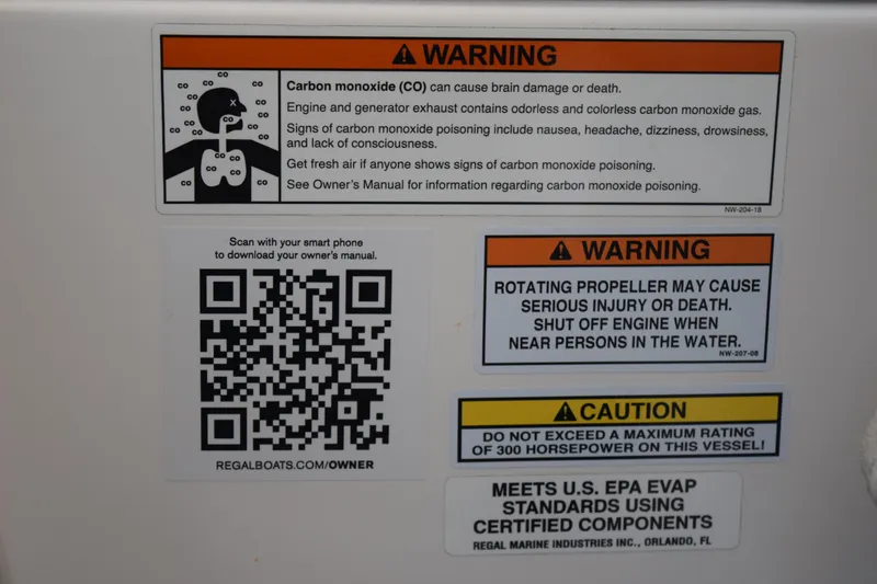Slide: The Image of Warning labels on a 2021 Regal 26 XO boat, including carbon monoxide and propeller safety. - 178