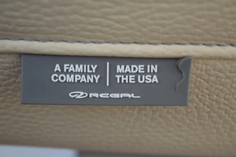 Slide: The Image of Plaque on Regal 26 XO boat, 2021 model, stating "A Family Company, Made in the USA." - 179