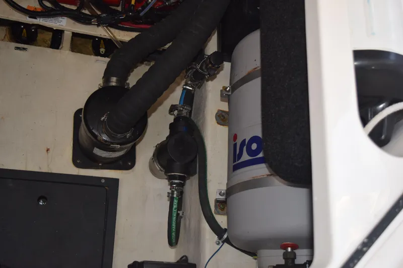 Slide: The Image of Engine compartment of 2021 Regal 26 XO boat with visible hoses and components. - 192